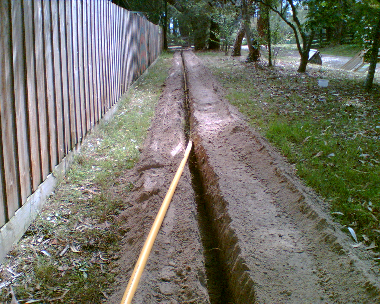Dingo's are excellent at trenching and easily compete with larger machines. They outperform all pedestrian trenchers. We can also remain on site to back fill the trench once the Electrician or Plumber has completed their task. An added bonus of our Dingo trencher is its ability to side shift - this allows trenches to be dug beside walls and fences.